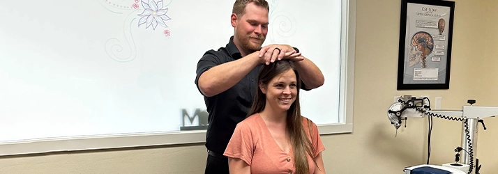 Chiropractor Missoula MT Bernard Olson Adjusting Patients Neck