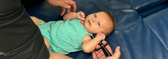 Chiropractor Missoula MT Bernard Olson Adjusting Pediatric Patient